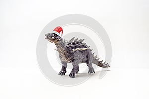 Polacanthus Dinosaur with Christmas hat on white background