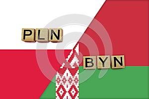 Poland and Belarus currencies codes on national flags background