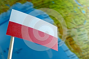 Poland flag with a globe map as a background