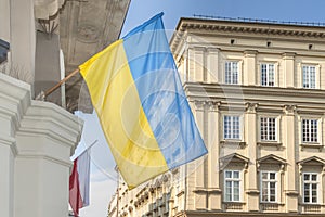 Poland, Krakow, Main Market, March 2022, Ukrainian Flag And Palac pod Baranami building