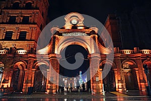 Poland, Lodz, Entrance to Manufaktura - shopping and leisure complex. Big red brick gate with a clock on top