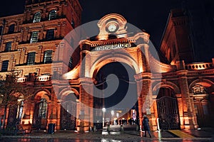 Poland, Lodz, Entrance to Manufaktura - shopping and leisure complex. Big red brick gate with a clock on top