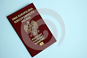 Poland passport on blue background close up