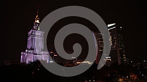 Poland, Warsaw, Palace of culture and science, night city is illuminated,