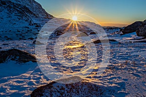 Polar arctic greenlandic sunset over the snow mountains, Nuuk, Greenland photo