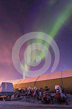 The polar arctic Northern lights aurora borealis sky star in Norway Svalbard Longyearbyen city mountains