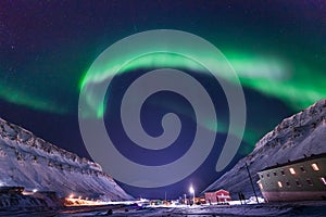 Polar arctic Northern lights aurora borealis sky star in Norway travel Svalbard in Longyearbyen city the moon mountains