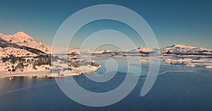 Polar arctic winter landscape over norwegian sea and snowy mountains hills Lofoten islands, Norway