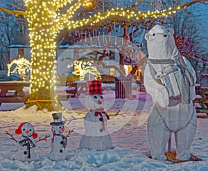 Polar bear family lit up at night for Christmas holiday