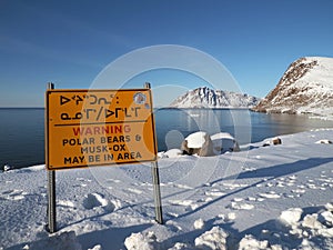 Polar bear warning sign in Inuktitut language, Canadian Arctic, Inuit