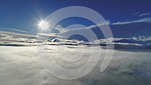 Polar sun above surface fog. Antarctic aerial shot