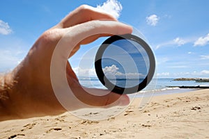 Polarizing filter hold against the beach giving clarity.