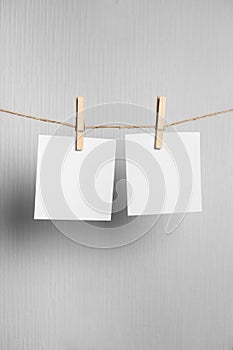 Polaroid frame.Retro photo frames hanging on rope isolated on white background. real photo. four frames