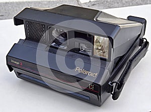 Polaroid Image 2 instant camera resting on a white surface