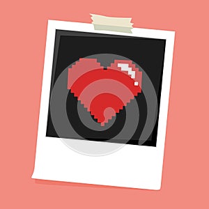 Polaroid photo frame with pixel heart icon.