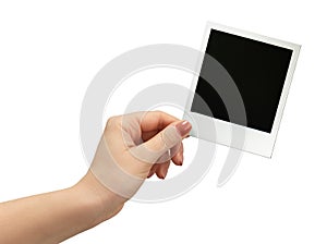 Polaroid photo in hand isolated