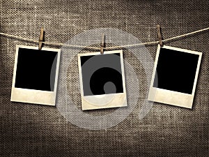 Polaroid style photographs hanging on a clothesline