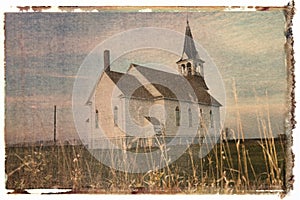 Polaroid transfer of rural church in field.