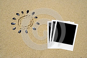 Polaroids photos in the sand