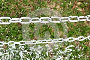 Pole chain on the grass.