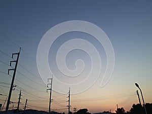 Pole Silhuettes Against Gradient Sky