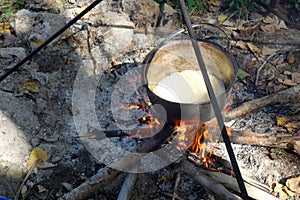 The polenta boils in the boiler. photo