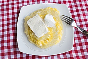 Polenta with Cheese and Sour Cream in a Plate