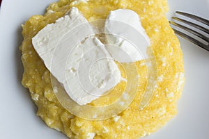 Polenta with Cheese and Sour Cream in a Plate