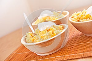 Polenta corn traditional food in wooden dish