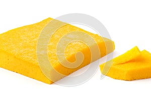 Polenta gialla su piatto di legno over white background photo