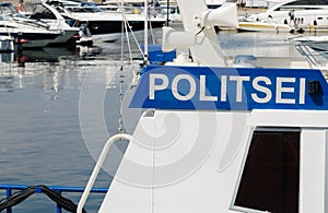 Police boat on a background of yachts