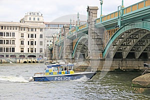 Police boat on the River Thames, London