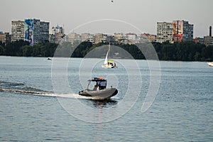 A police boat sails along the Dnieper River.