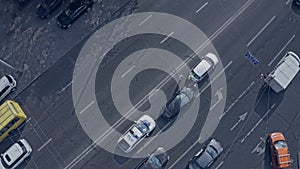 A police car arrives to establish the circumstances of the accident on the multi-lane road.