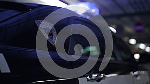 Police car body. Detailed shot of patrol vehicle parked at underground parking