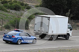 Police car chasing truck