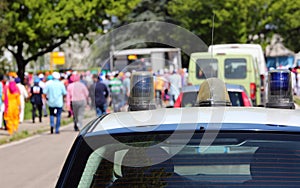 Police car during the demonstration with people photo