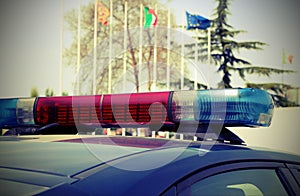 Police car with European flags on background outdoors