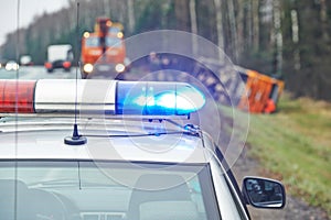 Police car with a flasher at lorry crash photo