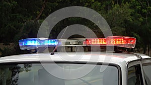 Police car flashing lights, closeup of photo with shallow depth of field