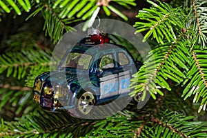 Police car hanging on Christmas tree as decoration