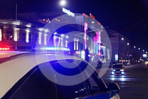 police car lights in night city with selective focus and bokeh