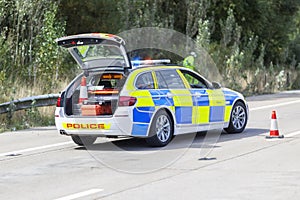 Police car at motorway accident or crime scene