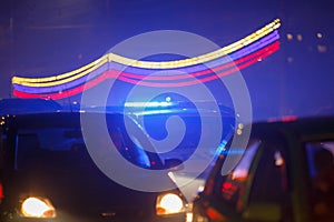 police car at night traffic with fog and russian flag white-blue-red colors garland