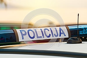 Police car roof sign policija in croatian language, closeup