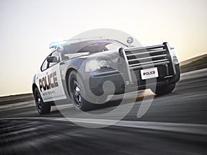 Police car running with lights and sirens on a street with motion blur