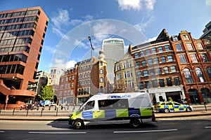 Police rushing to an incident on the streets of London, England