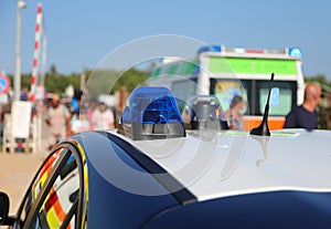 police car siren and ambulance on the background with people