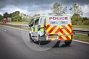 Police car siren flashing blue lights on motorway