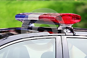Police car with siren light closeup